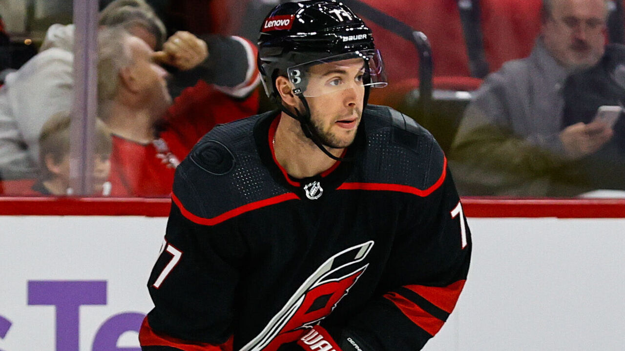 RALEIGH, NC - NOVEMBER 15: Tony DeAngelo #77 of the Carolina Hurricanes skates with the puck during the first period of the game against the Philadelphia Flyers at PNC Arena on November 15, 2023 in Raleigh, North Carolina.