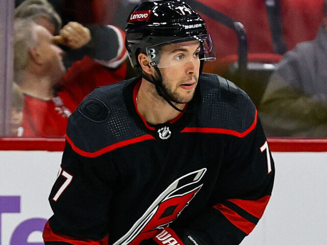 RALEIGH, NC - NOVEMBER 15: Tony DeAngelo #77 of the Carolina Hurricanes skates with the puck during the first period of the game against the Philadelphia Flyers at PNC Arena on November 15, 2023 in Raleigh, North Carolina.