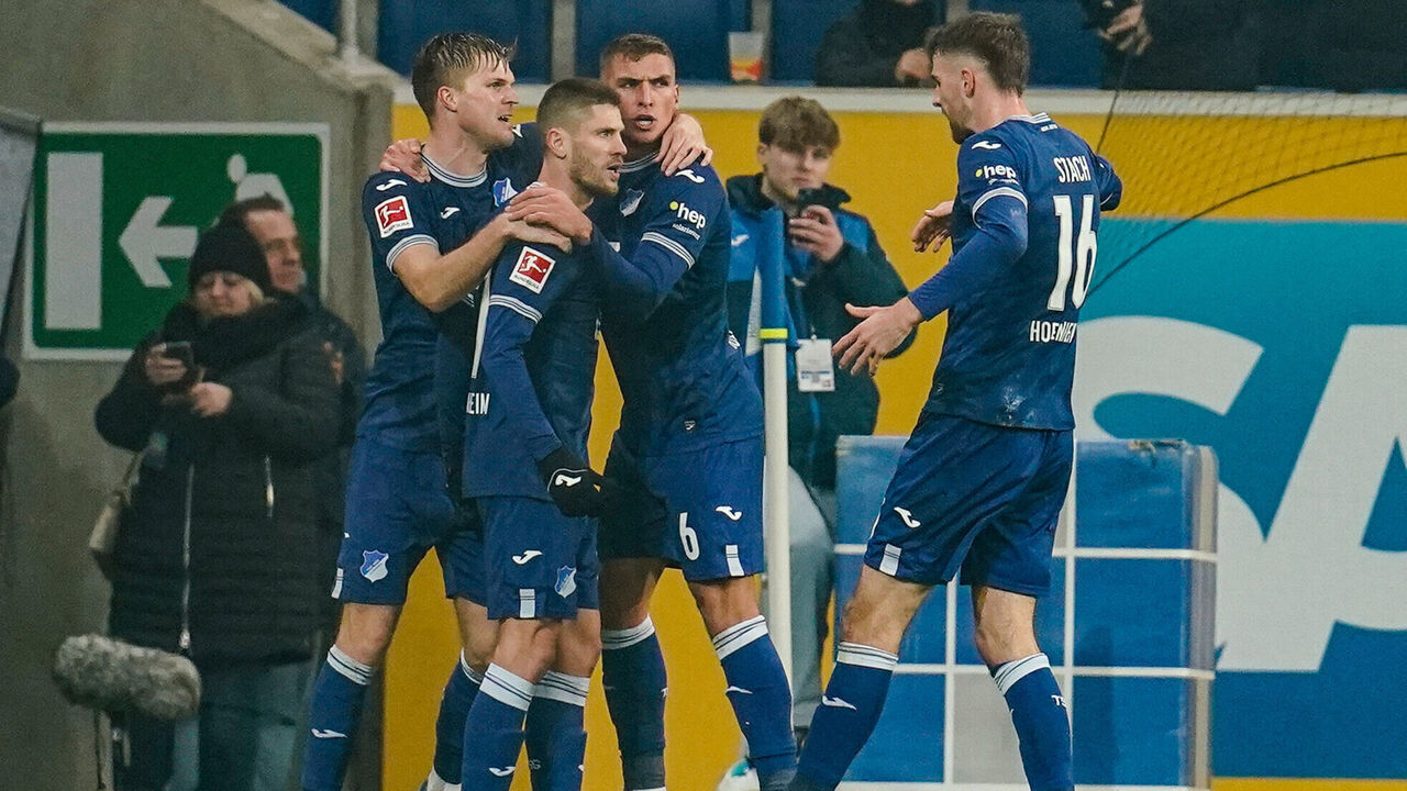 08 December 2023, Baden-Württemberg, Sinsheim: Soccer: Bundesliga, TSG 1899 Hoffenheim - VfL Bochum, Matchday 14, PreZero Arena. Hoffenheim's goalscorer Andrej Kramaric (2nd from left) celebrates the 2:0 goal with his teammates. Photo: Uwe Anspach/dpa - IMPORTANT NOTE: In accordance with the regulations of the DFL German Football League and the DFB German Football Association, it is prohibited to utilize or have utilized photographs taken in the stadium and/or of the match in the form of sequential images and/or video-like photo series.