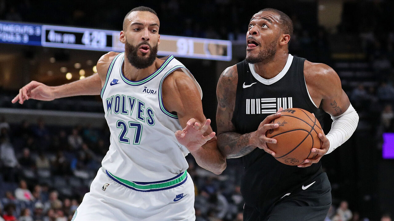 MEMPHIS, TENNESSEE - DECEMBER 08: Xavier Tillman #2 of the Memphis Grizzlies goes to the basket against Rudy Gobert #27 of the Minnesota Timberwolves during the second half at FedExForum on December 08, 2023 in Memphis, Tennessee.