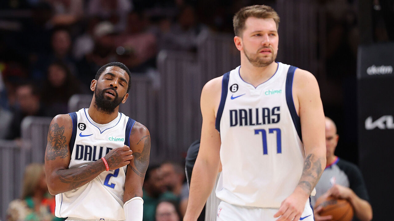 ATLANTA, GEORGIA - APRIL 02: Kyrie Irving #2 and Luka Doncic #77 of the Dallas Mavericks react against the Atlanta Hawks during the fourth quarter at State Farm Arena on April 02, 2023 in Atlanta, Georgia.