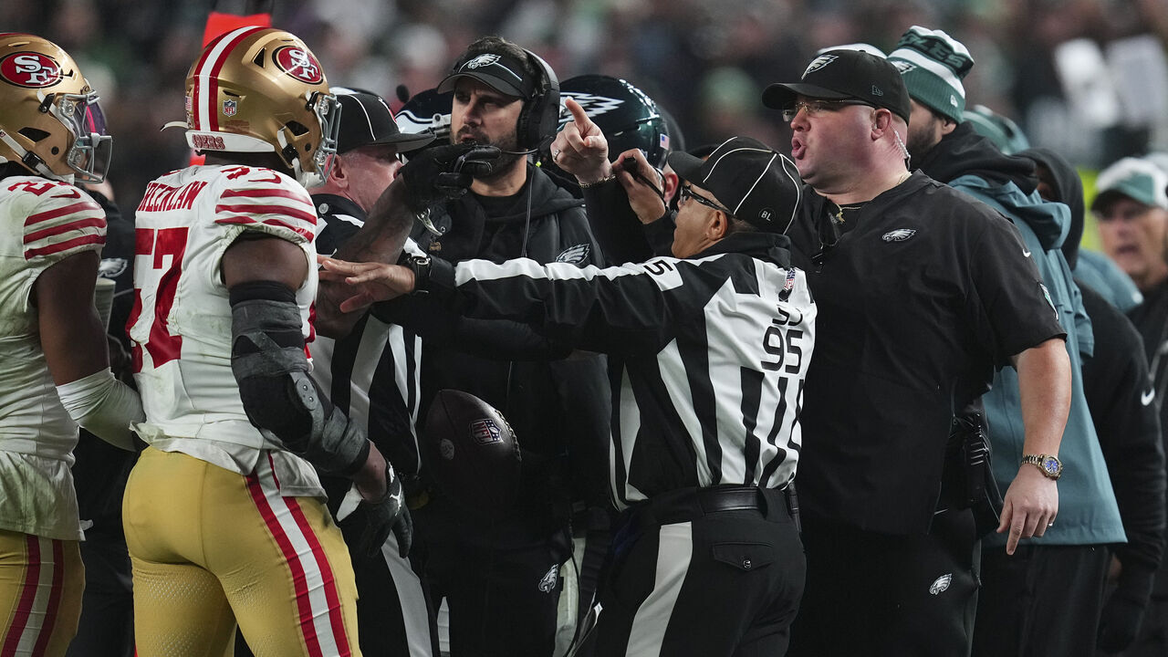 PHILADELPHIA, PENNSYLVANIA - DECEMBER 3: Dre Greenlaw #57 of the San Francisco 49ers gets into an altercation with head of security Dom DiSandro of the Philadelphia Eagles at Lincoln Financial Field on December 3, 2023 in Philadelphia, Pennsylvania.