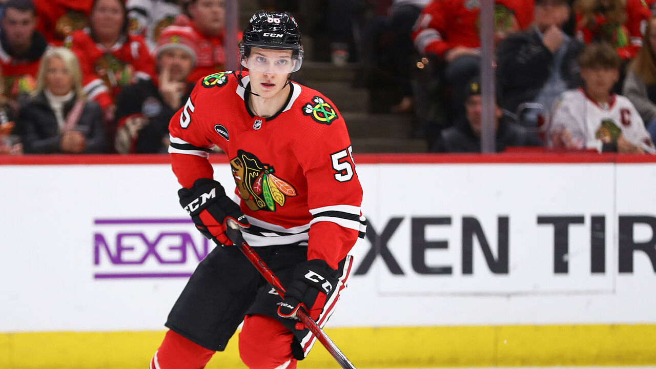 CHICAGO, IL - DECEMBER 07: Kevin Korchinski #55 of the Chicago Blackhawks controls the puck during the second period against the Anaheim Ducks at the United Center on December 7, 2023 in Chicago, Illinois.