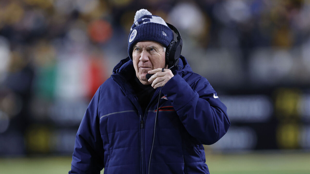 Pittsburgh, PA - December 7: New England Patriots head coach Bill Belichick adjusts his headset. The Patriots beat the Pittsburgh Steelers, 21-18.