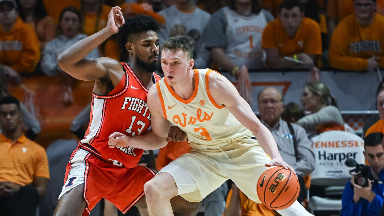 KNOXVILLE, TN - DECEMBER 09: Tennessee Volunteers guard Dalton Knecht (3) controls the ball against Illinois Fighting Illini forward Quincy Guerrier (13) during the college basketball game between the Tennessee Volunteers and the Illinois Fighting Illini on December 9, 2023, at Food City Center in Knoxville, TN.