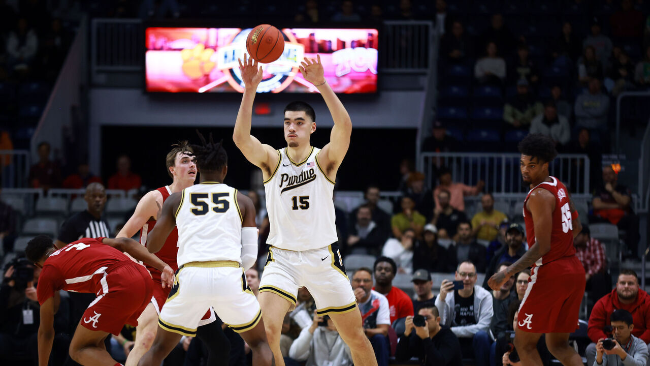 TORONTO, ON - DECEMBER 09: Zach Edey #15 of the Purdue Boilermaker passes the ball during a Discount Tire Hall of Fame Series game against the Alabama Crimson Tide at Coca-Cola Coliseum on December 09, 2023 in Toronto, Ontario, Canada.