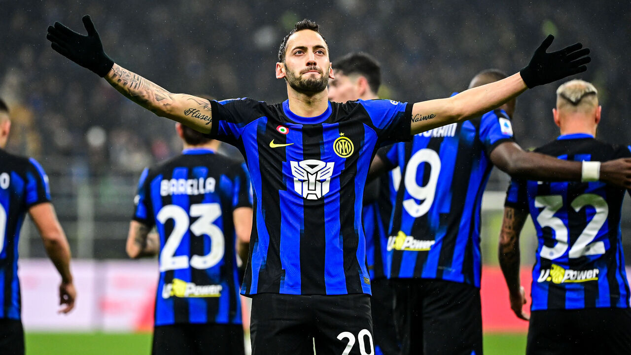 MILAN, ITALY - DECEMBER 9: Hakan Calhanoglu of FC Internazionale celebrates after scoring the team's first goal on penalty during the Italian Serie A football match FC Internazionale vs Udinese at San Siro Stadium in Milan, Italy on December 9, 2023