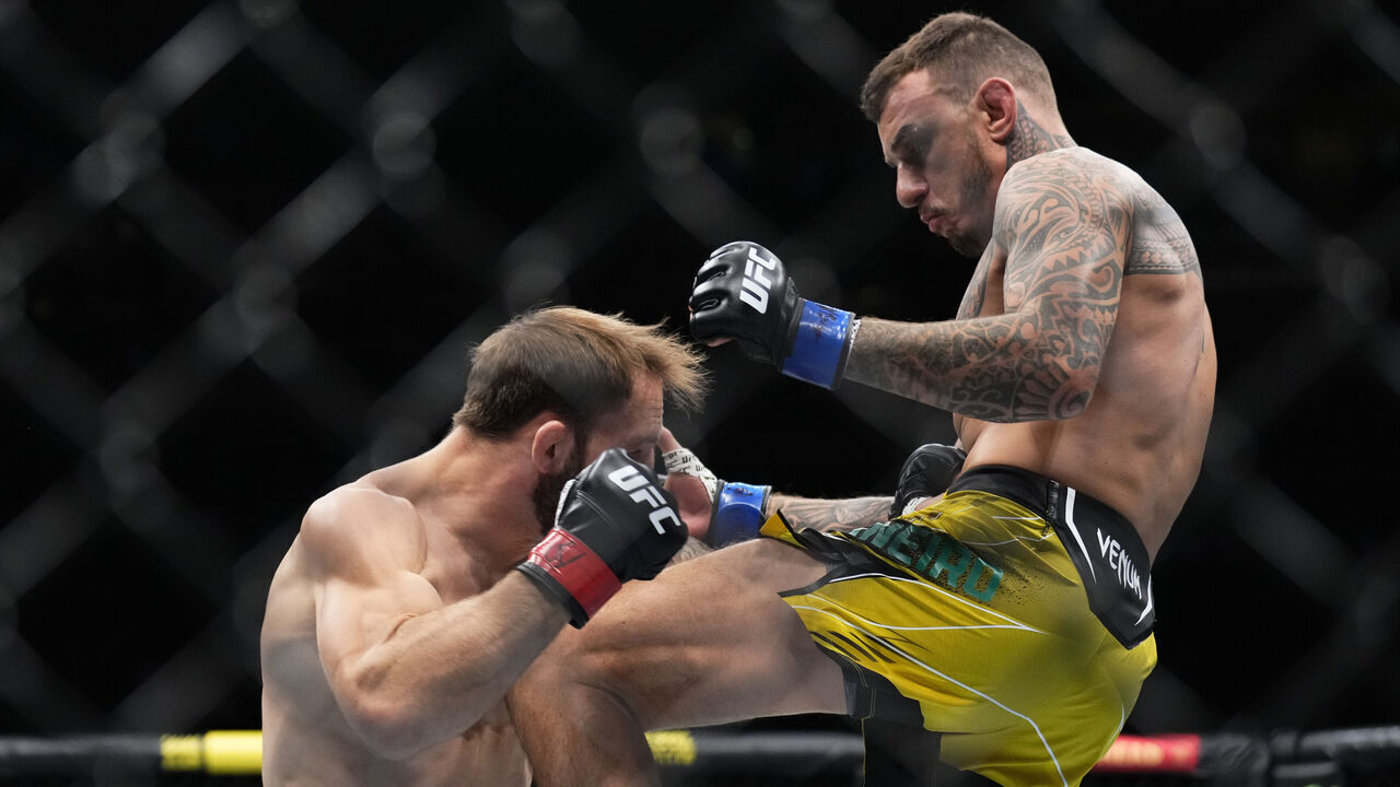 NEW YORK, NEW YORK - NOVEMBER 12: (R-L) Renato Moicano of Brazil knees Brad Riddell of New Zealand in a lightweight bout during the UFC 281 event at Madison Square Garden on November 12, 2022 in New York City.