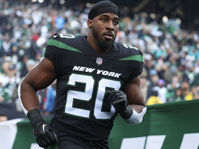 EAST RUTHERFORD, NJ - NOVEMBER 24: Breece Hall #20 of the New York Jets runs out of the tunnel prior to an NFL football game against the Miami Dolphins at MetLife Stadium on November 24, 2023 in East Rutherford, New Jersey.