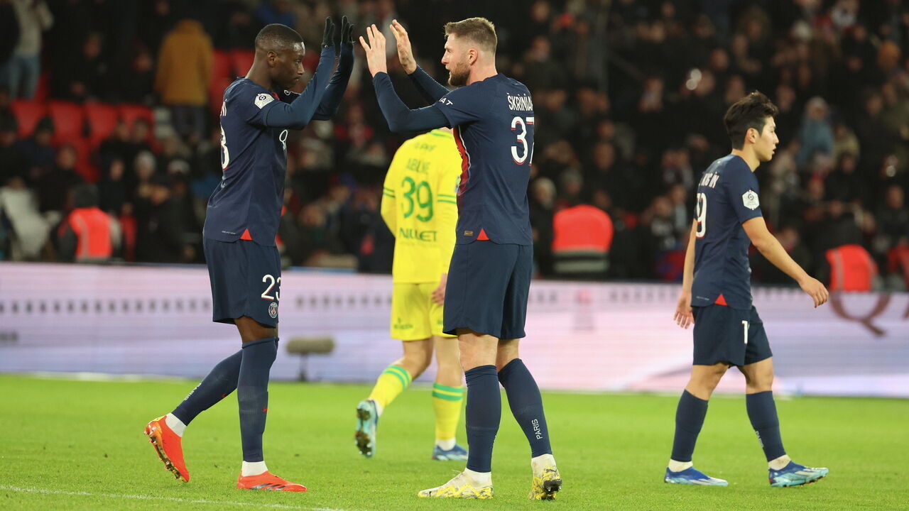 PARIS, FRANCE - DECEMBER 09: Randal Kolo Muani #23 of Paris Saint-Germain celebrate his first goal with Milan Skriniar #37 during the Ligue 1 Uber Eats match between Paris Saint-Germain and FC Nantes at Parc des Princes on December 09, 2023 in Paris, France.