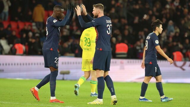 PARIS, FRANCE - DECEMBER 09: Randal Kolo Muani #23 of Paris Saint-Germain celebrate his first goal with Milan Skriniar #37 during the Ligue 1 Uber Eats match between Paris Saint-Germain and FC Nantes at Parc des Princes on December 09, 2023 in Paris, France.