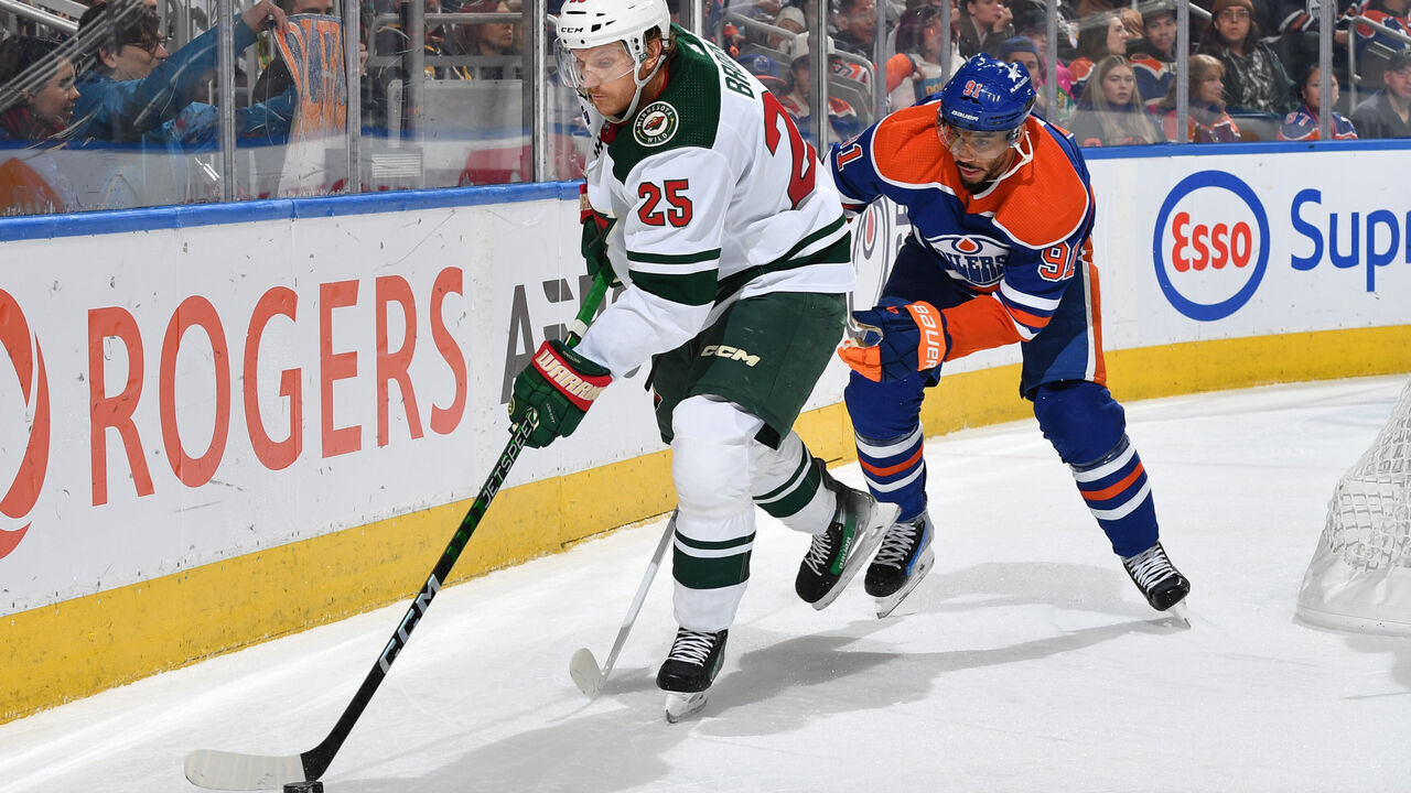 EDMONTON, CANADA - DECEMBER 08: Jonas Brodin #25 of the Minnesota Wild skates against Evander Kane #91 of the Edmonton Oilers during the game at Rogers Place on December 8, 2023, in Edmonton, Alberta, Canada.