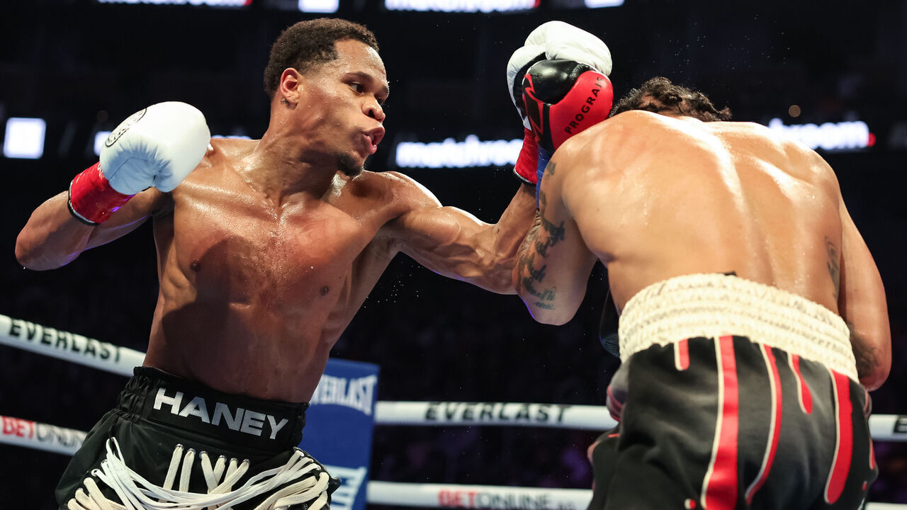 SAN FRANCISCO, CALIFORNIA - DECEMBER 09: Devin Haney punches Regis Prograis during their WBC World Super Lightweight Title fight at Chase Center on December 09, 2023 in San Francisco, California.