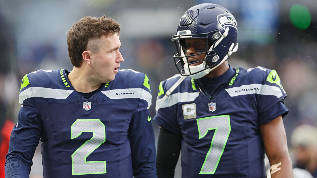 SEATTLE, WASHINGTON - NOVEMBER 12: Drew Lock #2 of the Seattle Seahawks and Geno Smith #7 of the Seattle Seahawks look on during the second quarter against the Washington Commanders at Lumen Field on November 12, 2023 in Seattle, Washington.