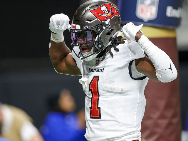 ATLANTA, GEORGIA - DECEMBER 10: Rachaad White #1 of the Tampa Bay Buccaneers reacts after rushing for a touchdown during the second half against the Atlanta Falcons at Mercedes-Benz Stadium on December 10, 2023 in Atlanta, Georgia.