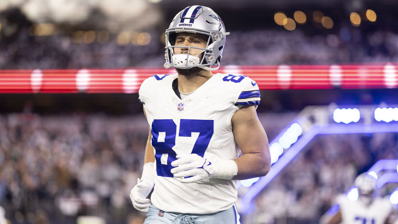 ARLINGTON, TEXAS - NOVEMBER 30: Jake Ferguson #87 of the Dallas Cowboys runs as he takes the field prior to an NFL football game between the Dallas Cowboys and the Seattle Seahawks at AT&T Stadium on November 30, 2023 in Arlington, Texas.