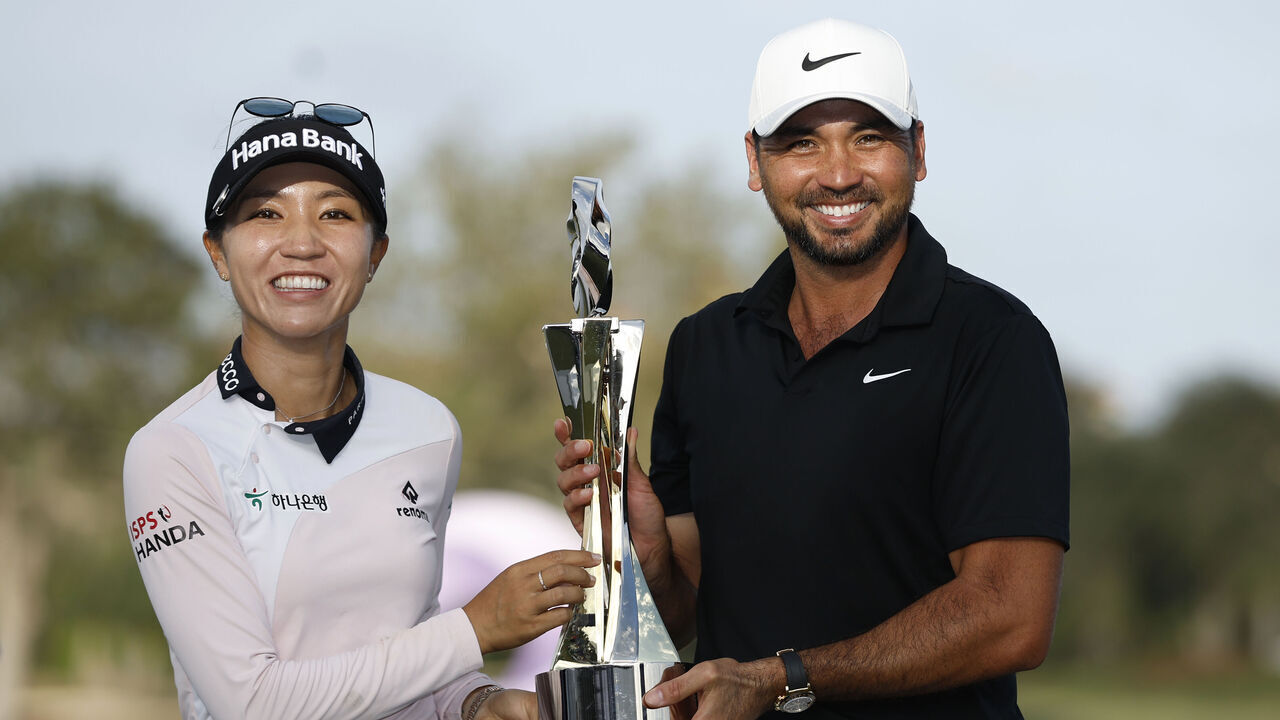 NAPLES, FLORIDA - DECEMBER 10: Lydia Ko of New Zealand and Jason Day of Australia celebrate with the trophy after winning during the final round of the Grant Thornton Invitational at Tiburon Golf Club on December 10, 2023 in Naples, Florida.