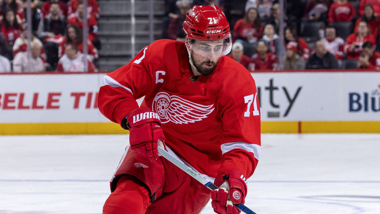 DETROIT, MI - DECEMBER 07: Dylan Larkin #71 of the Detroit Red Wings controls the puck against the San Jose Sharks during the third period at Little Caesars Arena on December 7, 2023 in Detroit, Michigan. San Jose defeated Detroit 6-5 in O.T.