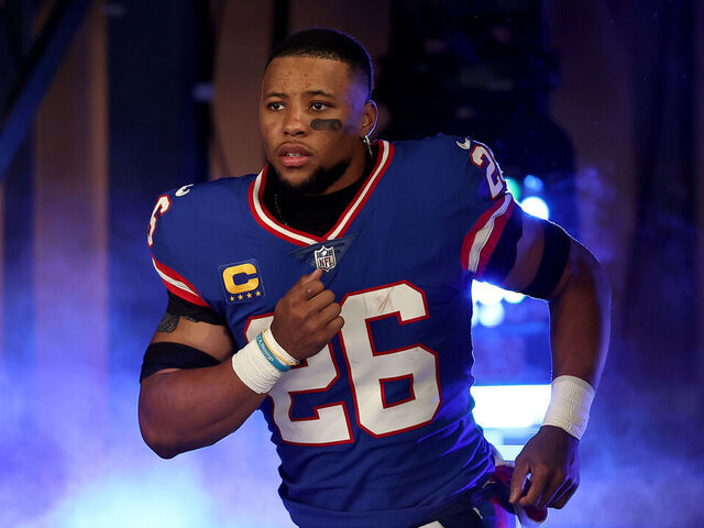 EAST RUTHERFORD, NEW JERSEY - DECEMBER 11: Saquon Barkley #26 of the New York Giants takes the field prior to the game against the Green Bay Packers during the first quarter in the game at MetLife Stadium on December 11, 2023 in East Rutherford, New Jersey.