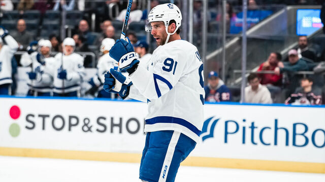 ELMONT, NEW YORK - DECEMBER 11: John Tavares #91 of the Toronto Maple Leafs celebrates a second period goal during the game vs. the New York Islanders at UBS Arena on December 11, 2023 in Elmont, New York.