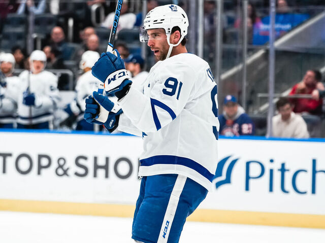 ELMONT, NEW YORK - DECEMBER 11: John Tavares #91 of the Toronto Maple Leafs celebrates a second period goal during the game vs. the New York Islanders at UBS Arena on December 11, 2023 in Elmont, New York.