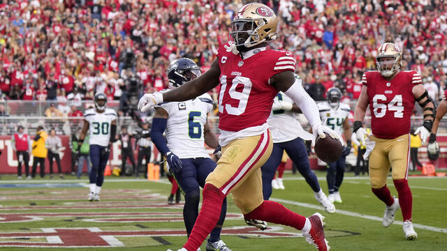 SANTA CLARA, CALIFORNIA - DECEMBER 10: Deebo Samuel #19 of the San Francisco 49ers score on a one yard touchdown run against the Seattle Seahawks during the third quarter of an NFL football game at Levi's Stadium on December 10, 2023 in Santa Clara, California.