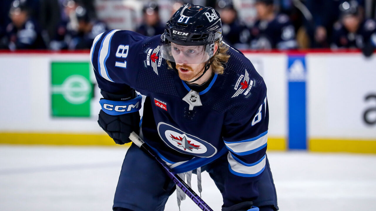 WINNIPEG, CANADA - NOVEMBER 14: Kyle Connor #81 of the Winnipeg Jets gets set during a third period face-off against the New Jersey Devils at the Canada Life Centre on November 14, 2023 in Winnipeg, Manitoba, Canada. The Jets defeated the Devils 6-3.