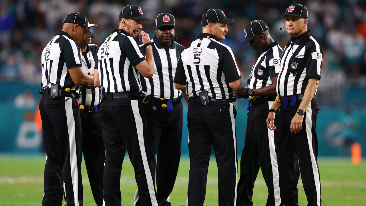 MIAMI GARDENS, FLORIDA - DECEMBER 11: NFL referees huddle during the fourth quarter of a game between the Tennessee Titans and Miami Dolphins at Hard Rock Stadium on December 11, 2023 in Miami Gardens, Florida.