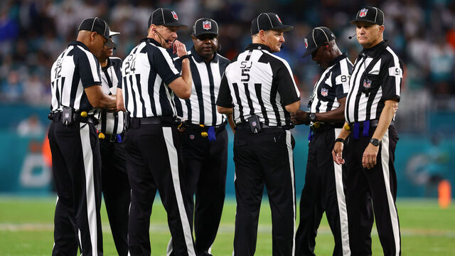 MIAMI GARDENS, FLORIDA - DECEMBER 11: NFL referees huddle during the fourth quarter of a game between the Tennessee Titans and Miami Dolphins at Hard Rock Stadium on December 11, 2023 in Miami Gardens, Florida.