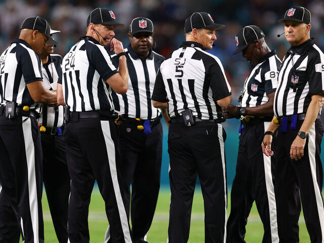 MIAMI GARDENS, FLORIDA - DECEMBER 11: NFL referees huddle during the fourth quarter of a game between the Tennessee Titans and Miami Dolphins at Hard Rock Stadium on December 11, 2023 in Miami Gardens, Florida.