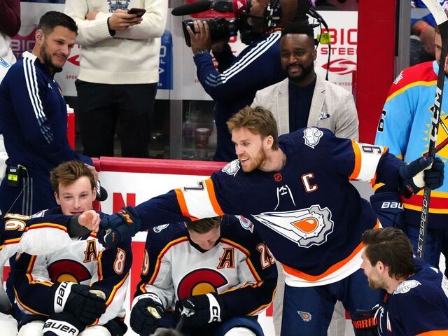 SUNRISE, FLORIDA - FEBRUARY 03: Connor McDavid #97 of the Edmonton Oilers fist bumps with Mikko Rantanen #96 of the Colorado Avalanche during the Honda NHL Accuracy Shooting event during the 2023 NHL All-Star Skills Competition at FLA Live Arena on February 03, 2023 in Sunrise, Florida.