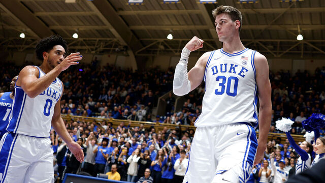 DURHAM, NORTH CAROLINA - DECEMBER 12: Kyle Filipowski #30 of the Duke Blue Devils reacts after a basket and a foul call during the first half of the game against the Hofstra Pride at Cameron Indoor Stadium on December 12, 2023 in Durham, North Carolina.