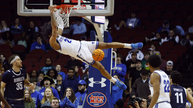 NEWARK, NEW JERSEY - DECEMBER 12: Isaiah Coleman #21 of the Seton Hall Pirates dunks against the Monmouth Hawks during the first half of a game at Prudential Center on December 12, 2023 in Newark, New Jersey.