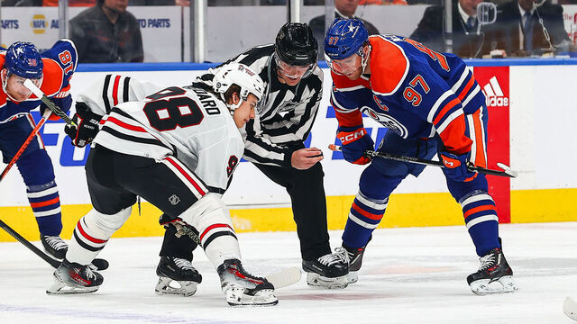EDMONTON, AB - DECEMBER 12: Chicago Blackhawks Center Connor Bedard (98) takes a face-off against Edmonton Oilers Center Connor McDavid (97) in the first period of the Edmonton Oilers game versus the Chicago Blackhawks on December 12, 2023 at Rogers Place in Edmonton, AB.