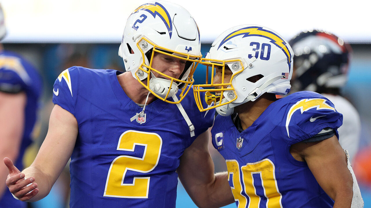 INGLEWOOD, CALIFORNIA - DECEMBER 10: Austin Ekeler #30 of the Los Angeles Chargers and Easton Stick #2 of the Los Angeles Chargers celebrate a touchdown during the fourth quarter against the Denver Broncos at SoFi Stadium on December 10, 2023 in Inglewood, California.