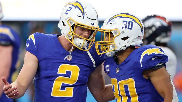 INGLEWOOD, CALIFORNIA - DECEMBER 10: Austin Ekeler #30 of the Los Angeles Chargers and Easton Stick #2 of the Los Angeles Chargers celebrate a touchdown during the fourth quarter against the Denver Broncos at SoFi Stadium on December 10, 2023 in Inglewood, California.