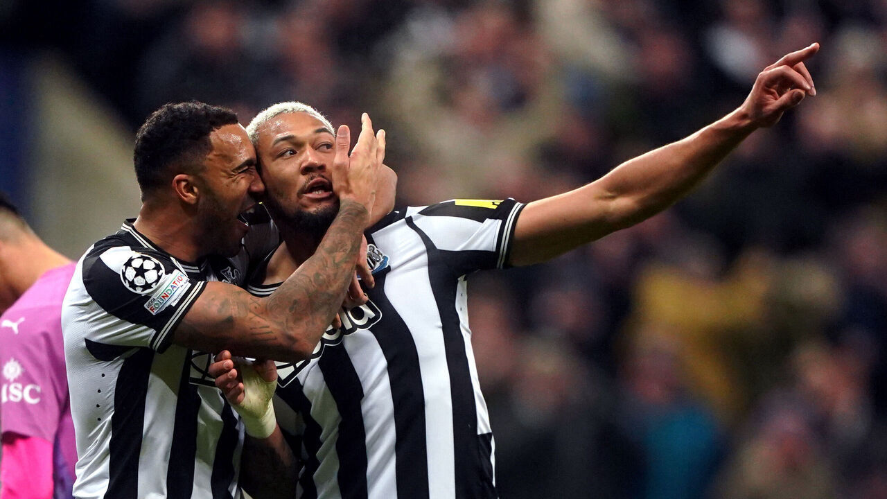 Newcastle United's Joelinton celebrates scoring the opening goal with Callum Wilson during the UEFA Champions League, Group F match at St James' Park, Newcastle. Picture date: Wednesday December 13, 2023.
