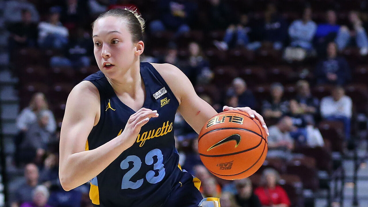 UNCASVILLE, CT - MARCH 04: Marquette Golden Eagles forward Liza Karlen (32) drives past St. John's Red Storm guard Jayla Everett (4) during the Big East Women's Basketball Tournament game between Marquette Golden Eagles and St John's Red Storm on March 4, 2023, at Mohegan Sun Arena in Uncasville, CT.