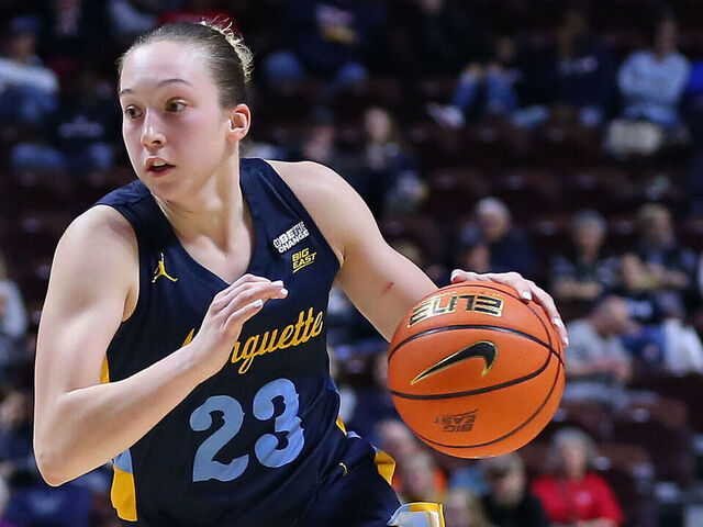 UNCASVILLE, CT - MARCH 04: Marquette Golden Eagles forward Liza Karlen (32) drives past St. John's Red Storm guard Jayla Everett (4) during the Big East Women's Basketball Tournament game between Marquette Golden Eagles and St John's Red Storm on March 4, 2023, at Mohegan Sun Arena in Uncasville, CT.