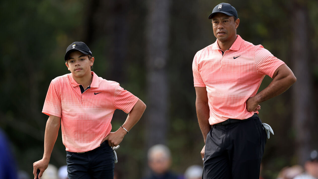 ORLANDO, FLORIDA - DECEMBER 17: Tiger Woods of The United States and his son Charlie Woods wait to putt on the third hole during the first round of the 2022 PNC Championship at The Ritz-Carlton Golf Club on December 17, 2022 in Orlando, Florida.
