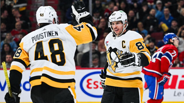 MONTREAL, QC - DECEMBER 13: Pittsburgh Penguins center Sidney Crosby (87) celebrates his goal with Pittsburgh Penguins right wing Valtteri Puustinen (48) during the Pittsburgh Penguins versus the Montreal Canadiens game on December 13, 2023, at Bell Centre in Montreal, QC