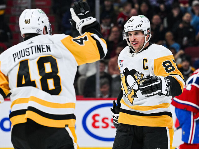 MONTREAL, QC - DECEMBER 13: Pittsburgh Penguins center Sidney Crosby (87) celebrates his goal with Pittsburgh Penguins right wing Valtteri Puustinen (48) during the Pittsburgh Penguins versus the Montreal Canadiens game on December 13, 2023, at Bell Centre in Montreal, QC