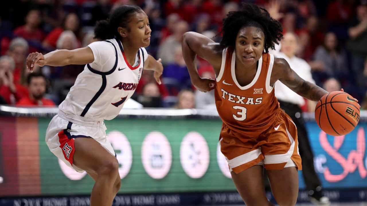 TUCSON, AZ - DECEMBER 13: Texas Longhorns guard Rori Harmon #3 drives past Arizona Wildcats guard Courtney Blakely #1 during the second half of a women's basketball game between the Texas Longhorns and the University of Arizona Wildcats on December 13, 2023 at McKale Center in Tucson, AZ. (Photo by Christopher Hook/Icon Sportswire via Getty Images