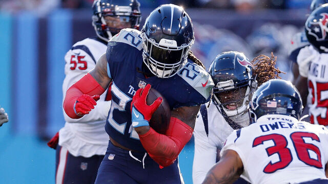 NASHVILLE, TENNESSEE - DECEMBER 24: Derrick Henry #22 of the Tennessee Titans runs the ball during the first half in the game against the Houston Texans at Nissan Stadium on December 24, 2022 in Nashville, Tennessee.