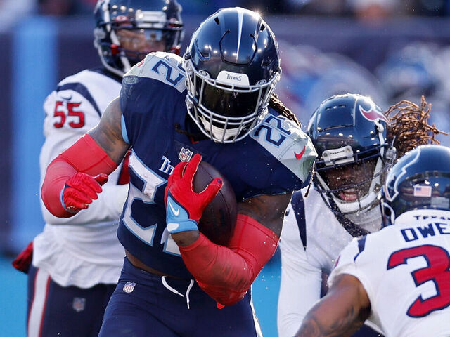 NASHVILLE, TENNESSEE - DECEMBER 24: Derrick Henry #22 of the Tennessee Titans runs the ball during the first half in the game against the Houston Texans at Nissan Stadium on December 24, 2022 in Nashville, Tennessee.