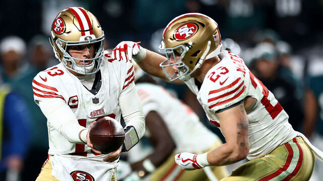 PHILADELPHIA, PENNSYLVANIA - DECEMBER 03: Brock Purdy #13 of the San Francisco 49ers hands the ball off to Christian McCaffrey #23 in the game against the Philadelphia Eagles during the third quarter at Lincoln Financial Field on December 03, 2023 in Philadelphia, Pennsylvania.