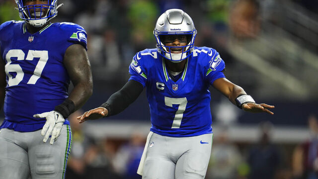 ARLINGTON, TX - NOVEMBER 30: Geno Smith #7 of the Seattle Seahawks celebrates during an NFL football game against the Dallas Cowboys at AT&T Stadium on November 30, 2023 in Arlington, Texas.