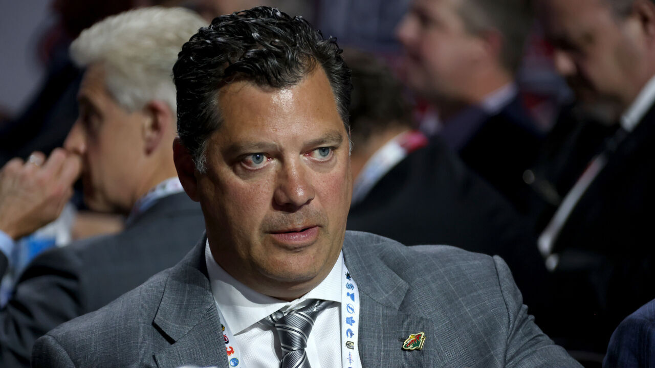 MONTREAL, QUEBEC - JULY 07: General manager Bill Guerin of the Minnesota Wild looks on from the draft table during the first round of the 2022 Upper Deck NHL Draft at Bell Centre on July 07, 2022 in Montreal, Quebec.
