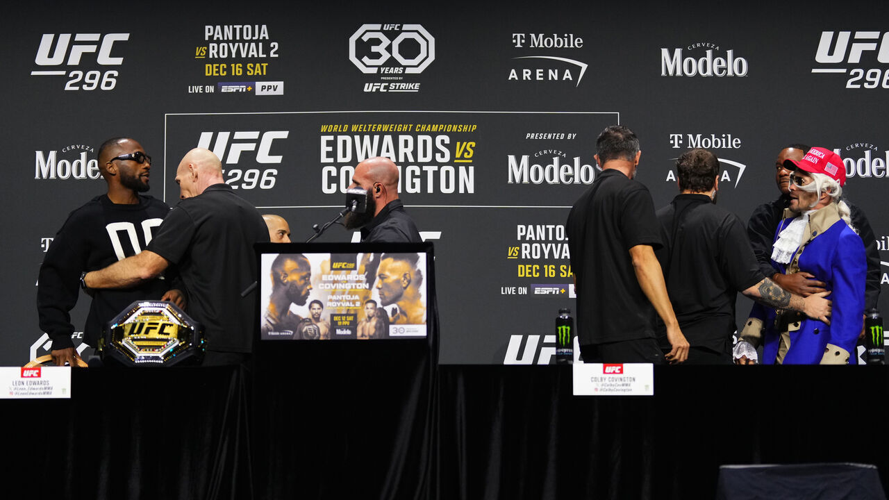 LAS VEGAS, NEVADA - DECEMBER 14: (L-R) Leon Edwards of Jamaica and Colby Covington are separated by security during the UFC 296 press conference at MGM Grand Garden Arena on December 14, 2023 in Las Vegas, Nevada.