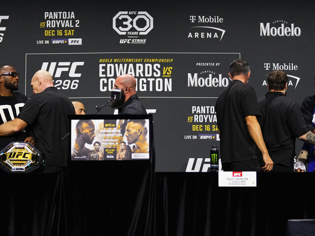 LAS VEGAS, NEVADA - DECEMBER 14: (L-R) Leon Edwards of Jamaica and Colby Covington are separated by security during the UFC 296 press conference at MGM Grand Garden Arena on December 14, 2023 in Las Vegas, Nevada.